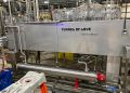Photo of tunnel of love tunnel pasteurizer set in a beverage production facility